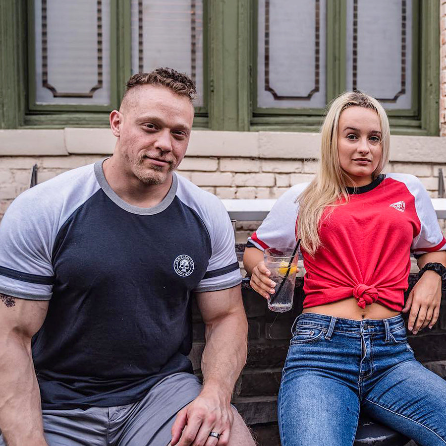 Man and woman in Double ringer tees sitting