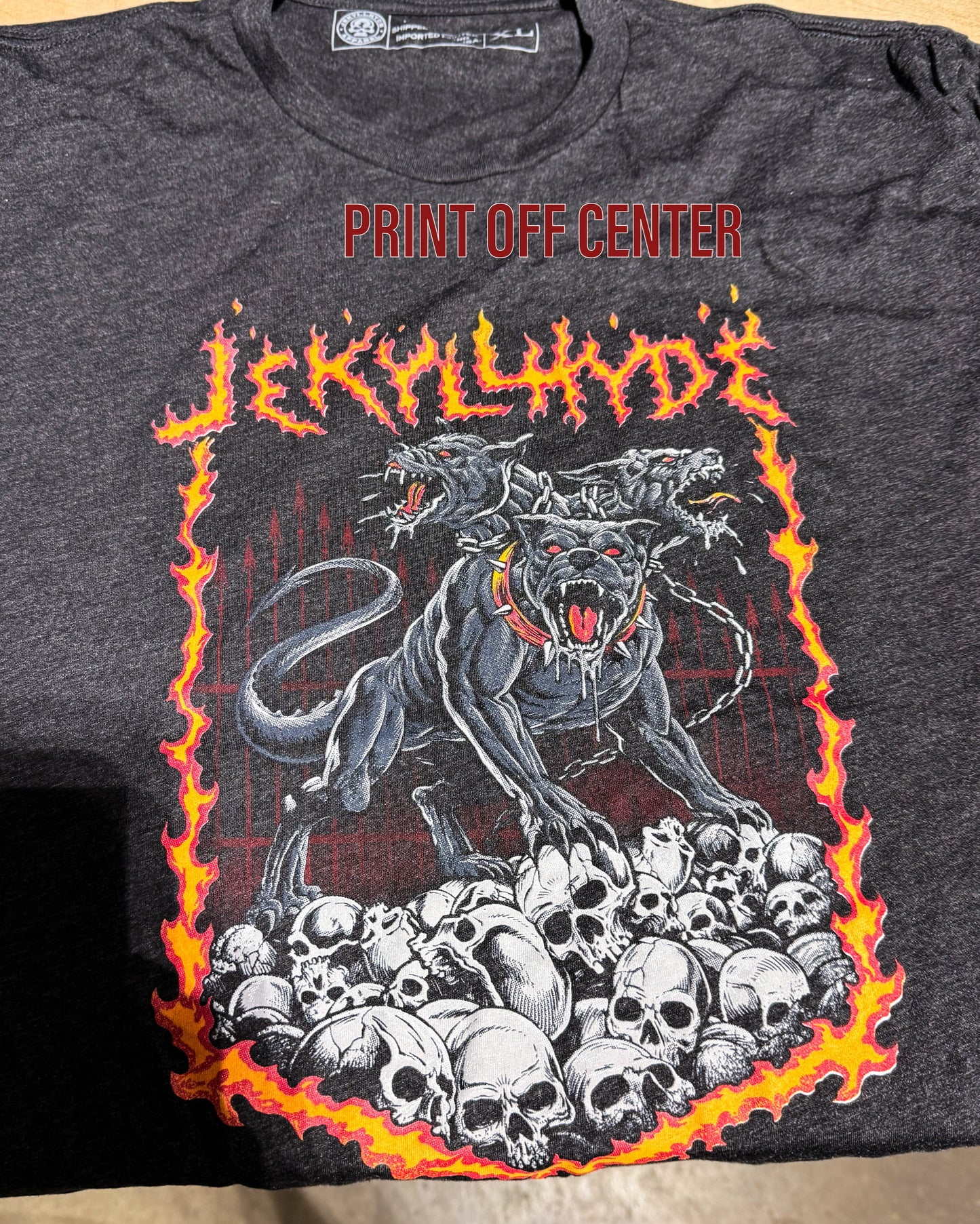 Flat Lay of Jekyllhyde Cerberus tshirt with print off centered. 