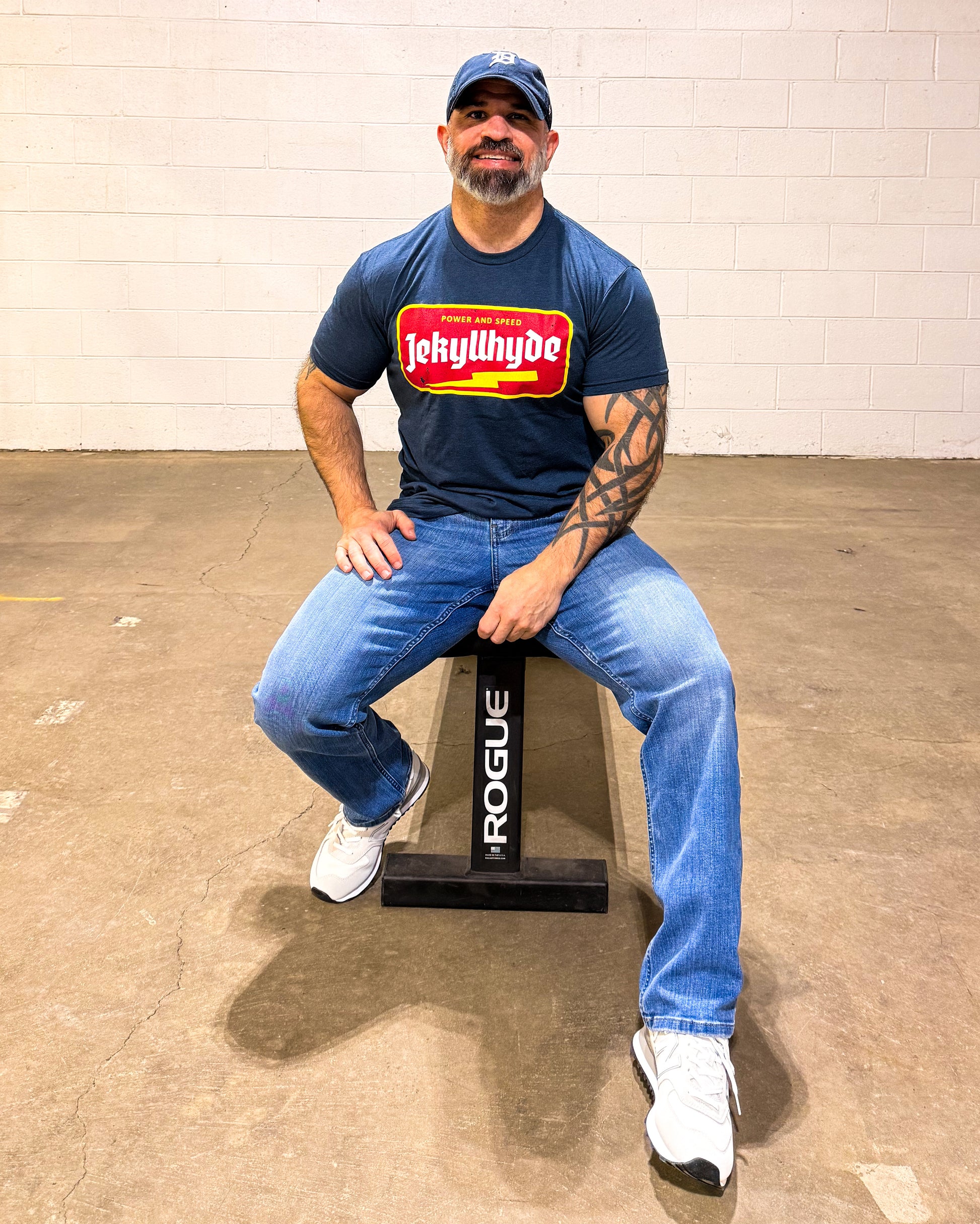 man sitting on a bench in blue tshirt