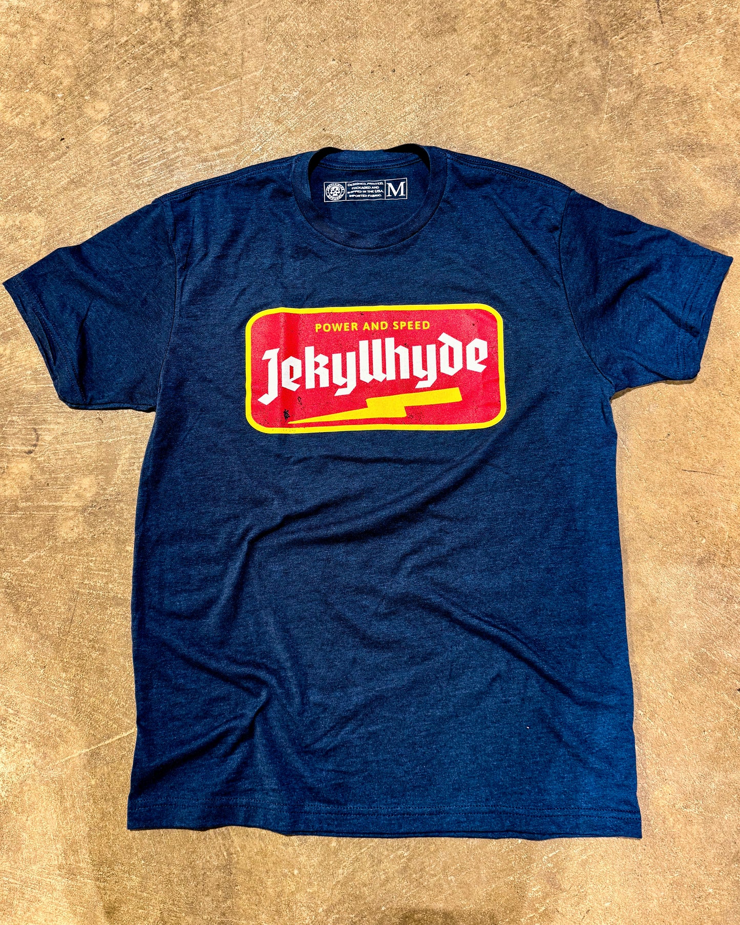 Flat lay of navy tshirt with lightning bolt jekyllhyde name