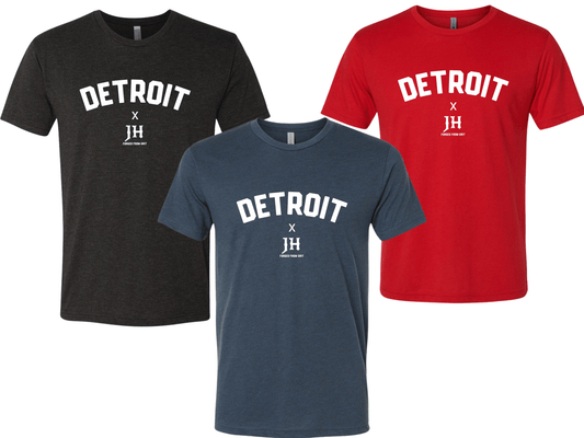 Three t-shirts in black, blue, and red with 'DETROIT X JH' text on a white background.