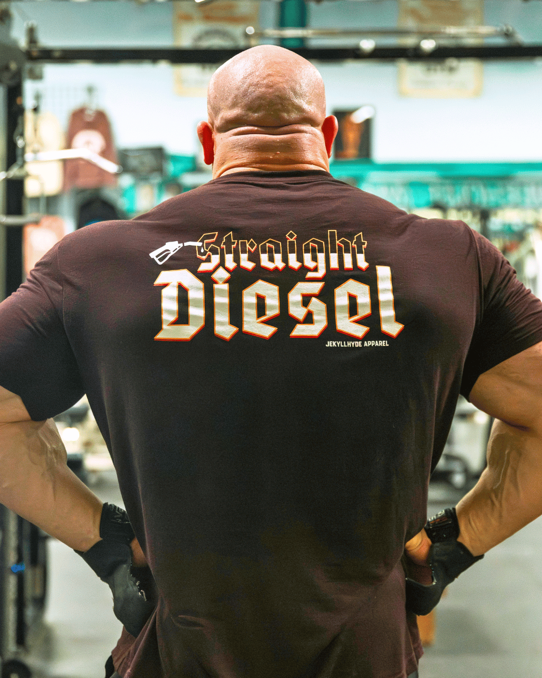 Man flexing his back muscles with a tshirt that reads "straight diesel"