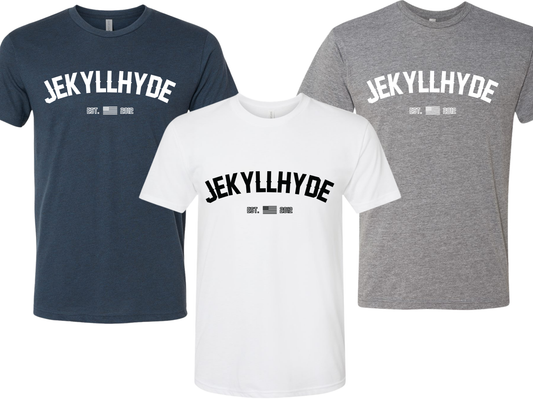 Three short-sleeve crewneck t-shirts shown on a white background: navy blue, white, and heather gray, each with large arched 'JEKYLLHYDE' text across the chest in white or black, plus smaller text below.