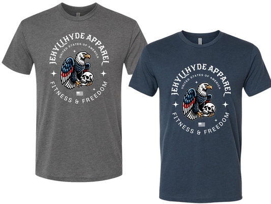 Two crew-neck graphic T-shirts shown side by side on a plain white background. The left shirt is heather gray and the right shirt is heather navy. Both have an Eagle holding a skull.