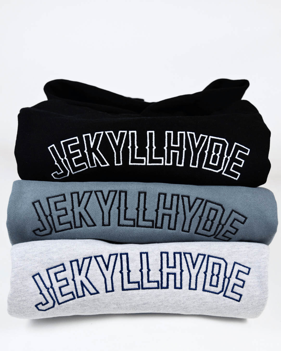 3 folded a stacked hoodies with the embroidered text that reads Jekyllhyde. 