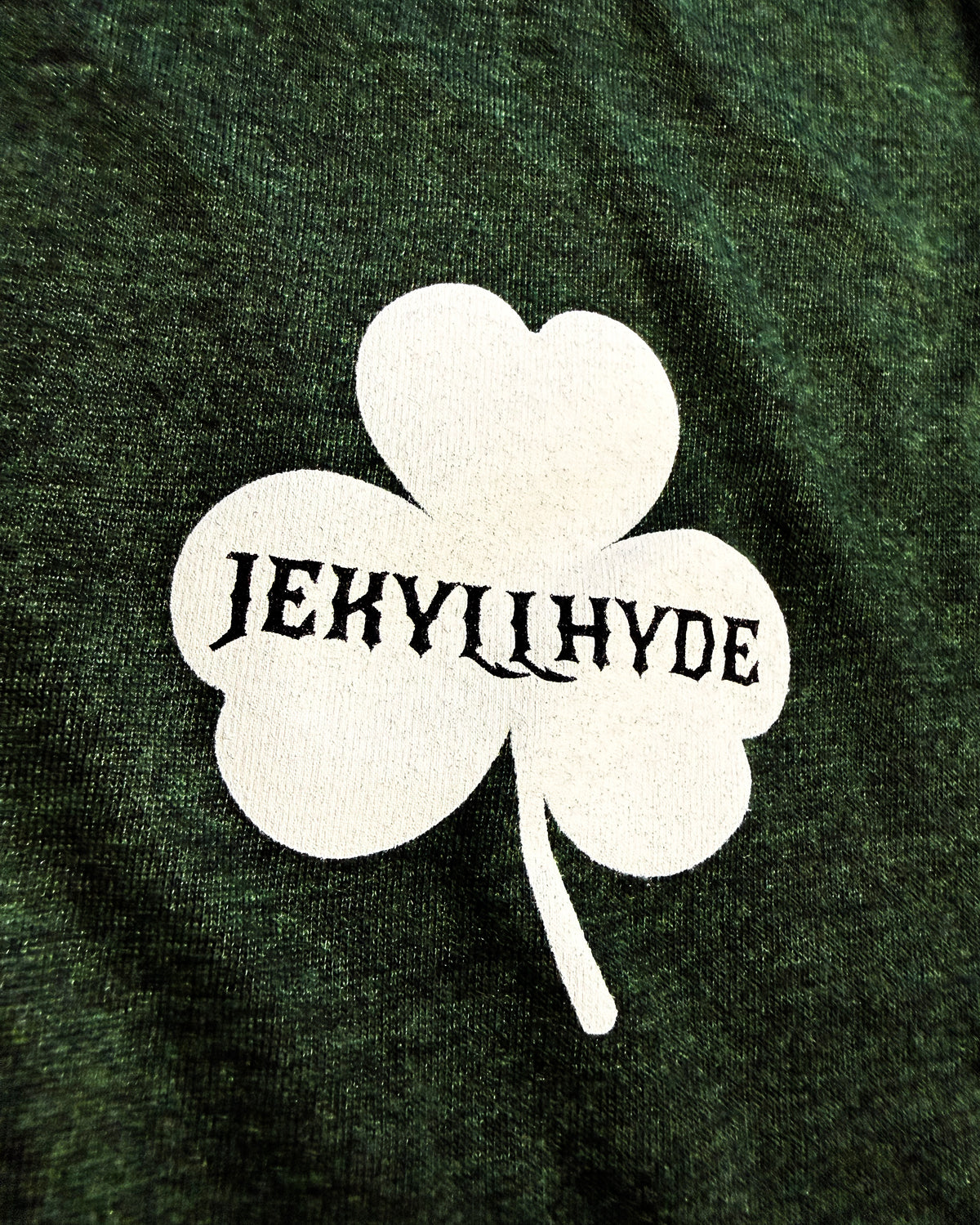 White shamrock with 'Jekyll Hyde' text on a dark green background