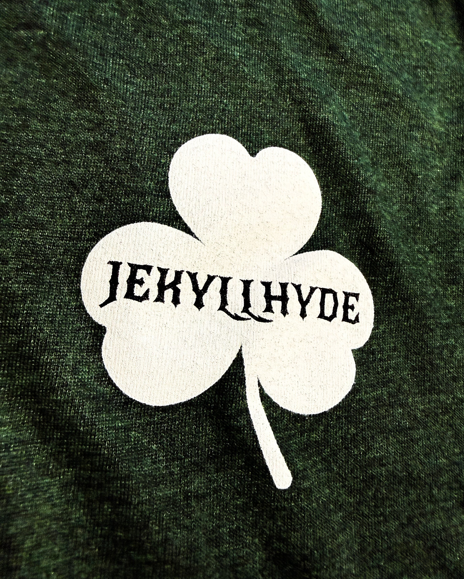 White shamrock with 'Jekyll Hyde' text on a dark green background