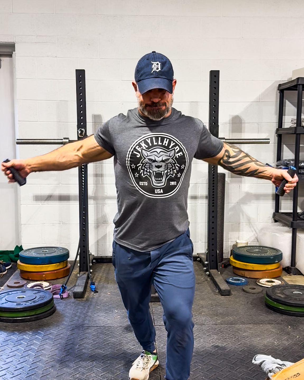 Man exercising with weights in a gym setting