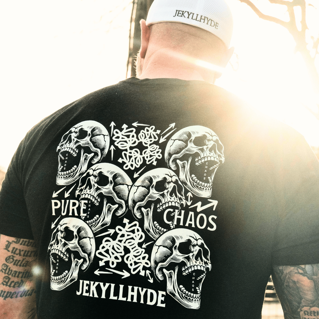 Person wearing a black t-shirt with skull designs and 'Jekyll Hyde' branding.