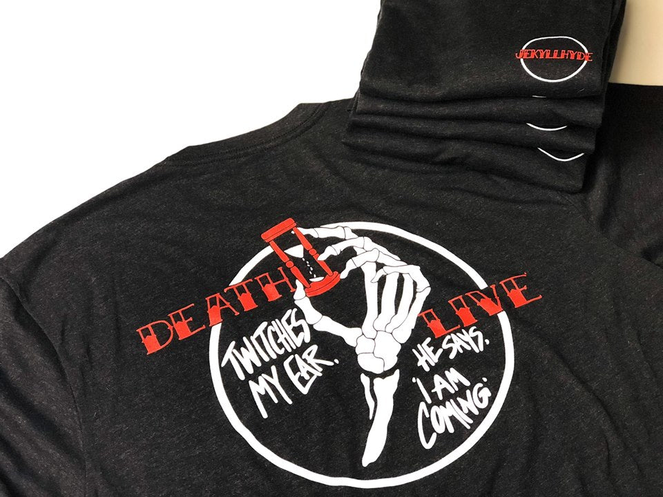black tshirt on a white background with skeleton hand holding a hour glass. 