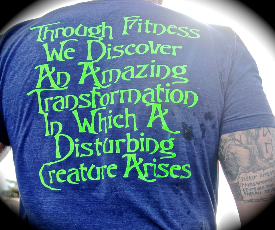 Back of a blue tshirt with bright green text. 