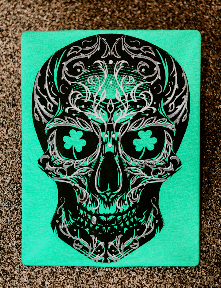Flat lay of Sugar skull with shamrock eyes. 