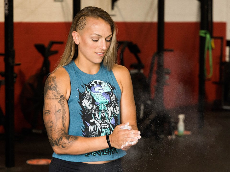 Woman chalking her hands. 