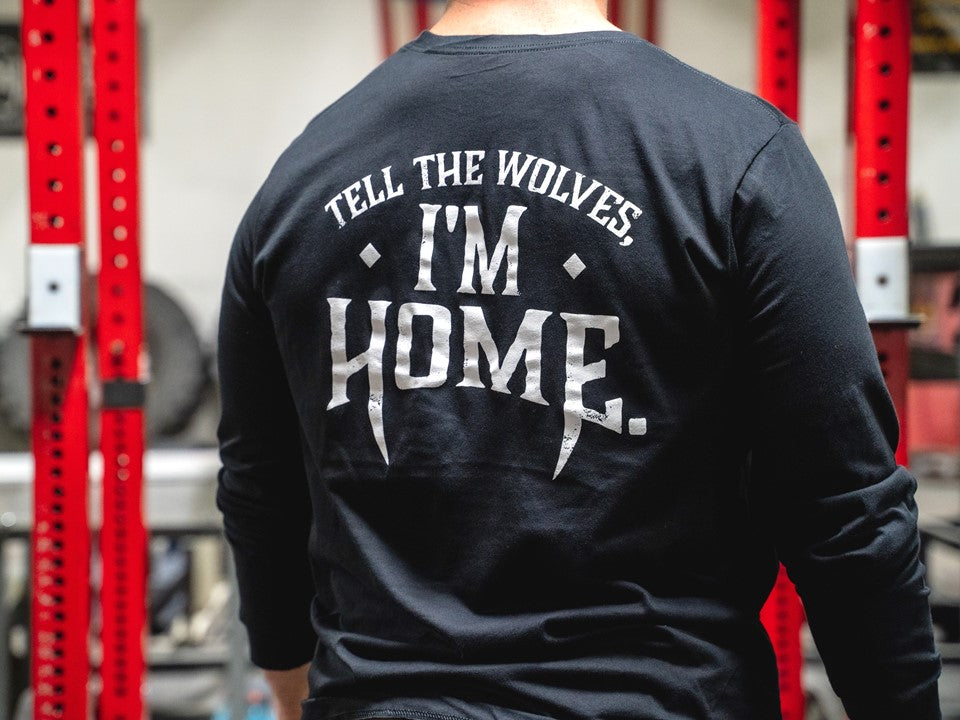 Man standing in black long sleeve shirt. 
