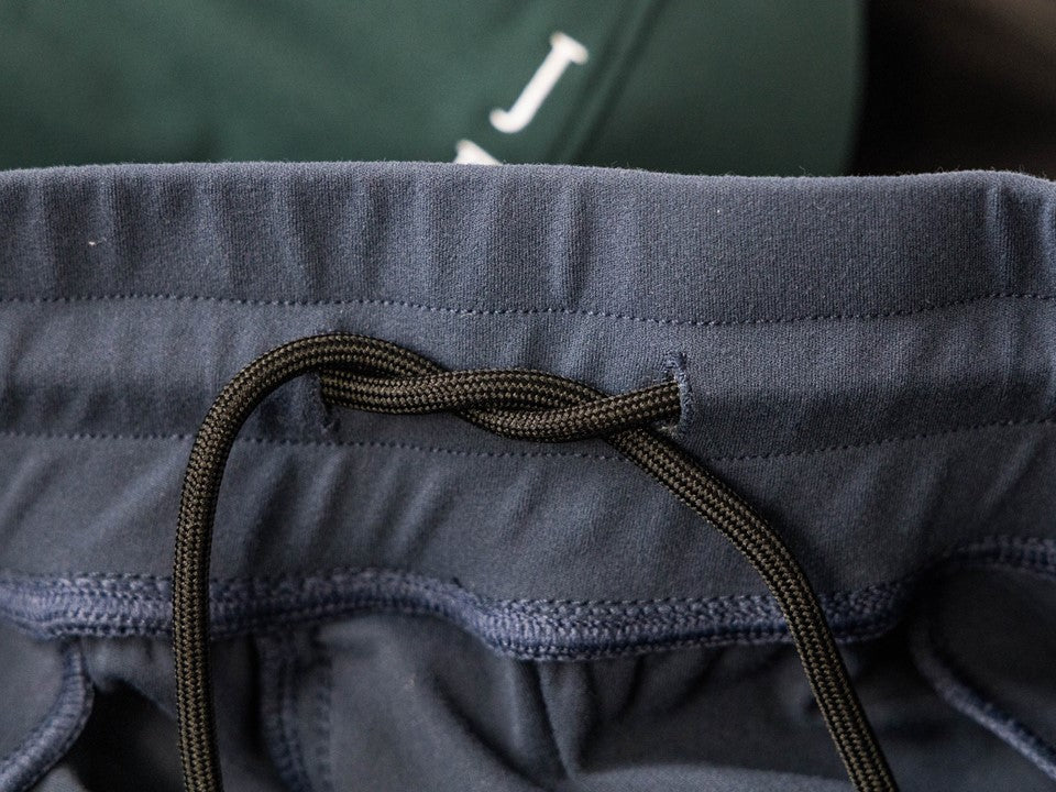 Close up on an internal drawstring on a waistband.