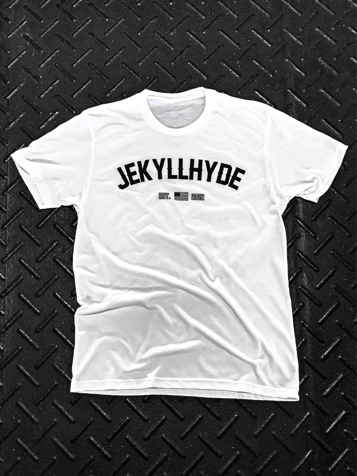 White shirt with Jekyllhyde branding on it laying on black diamond pattern flooring. 