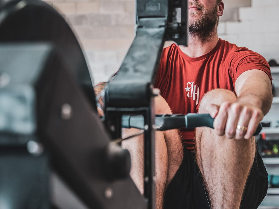 Man on rowing machine. 