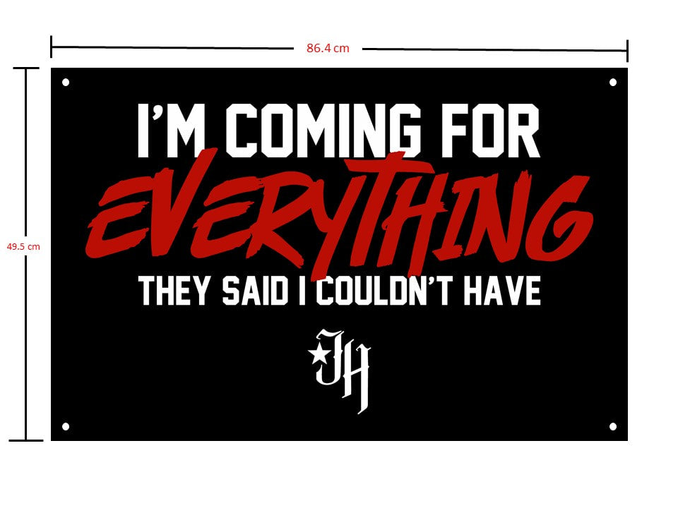 A black gym flag with a motivational saying on it. 