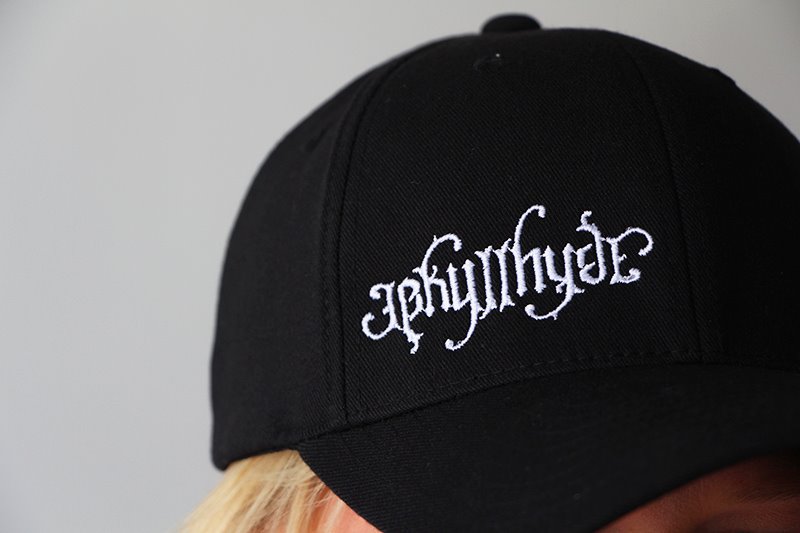 Close up of the embroidered Jekyllhyde logo on a black baseball hat. 