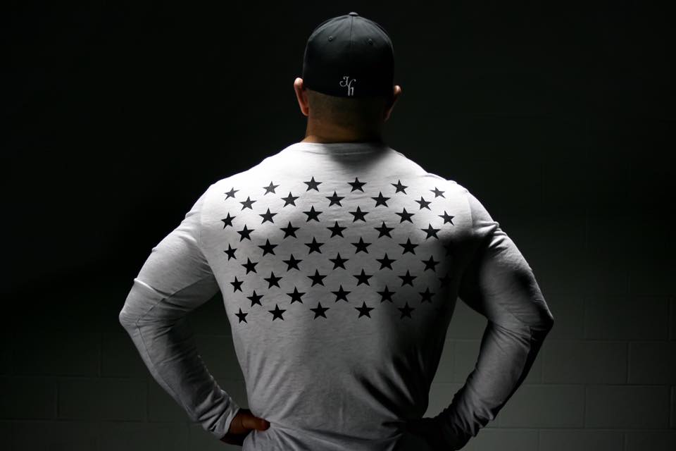Long sleeve white shirt with black stars. 