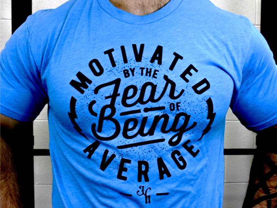 Close up of a blue shirt with a motivational saying on it. 