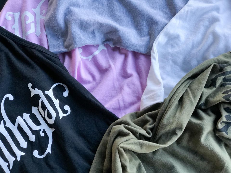 Tank tops laying in a pile. 