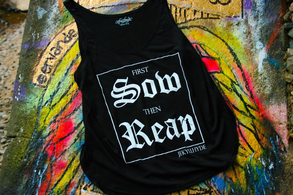 Black tank top on colorful graffiti background.  
