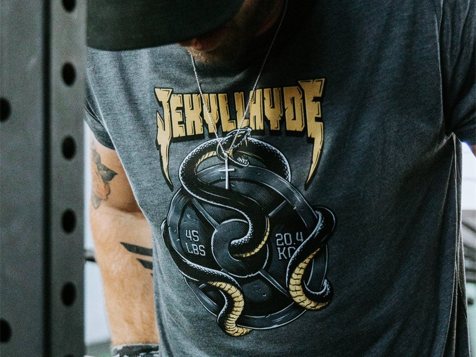 Close up of a grey tshirt with a snake and weight. 