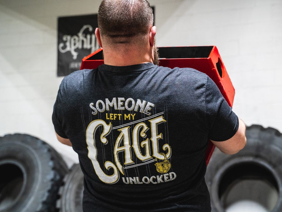 Strongman holding a heavy object. 